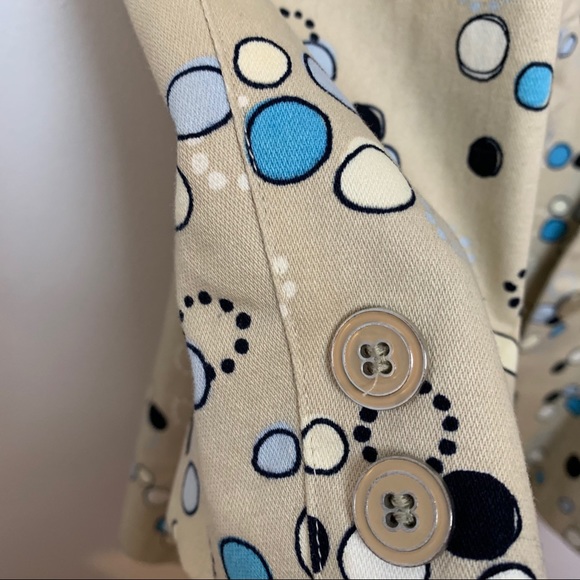 I.e. Tan trench coat with Mod circle design. - Picture 4 of 8